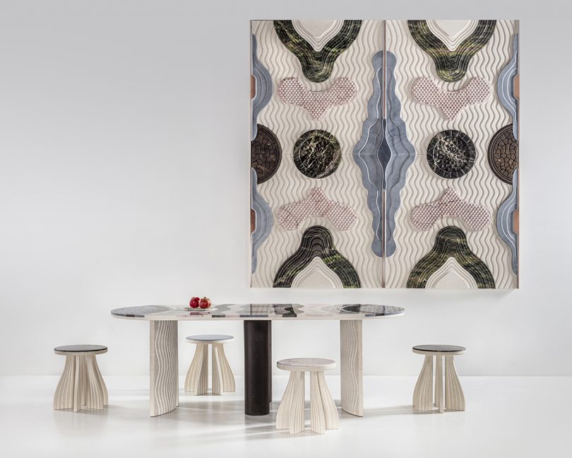 wall textile with dining table and stools