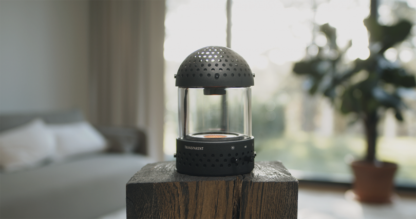 speaker/lantern combo sitting on an end table indoors