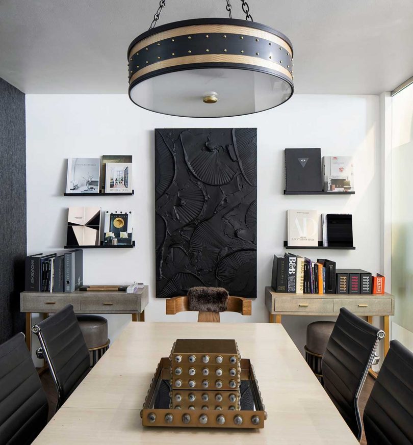 modern office with long conference table in black and white color palette