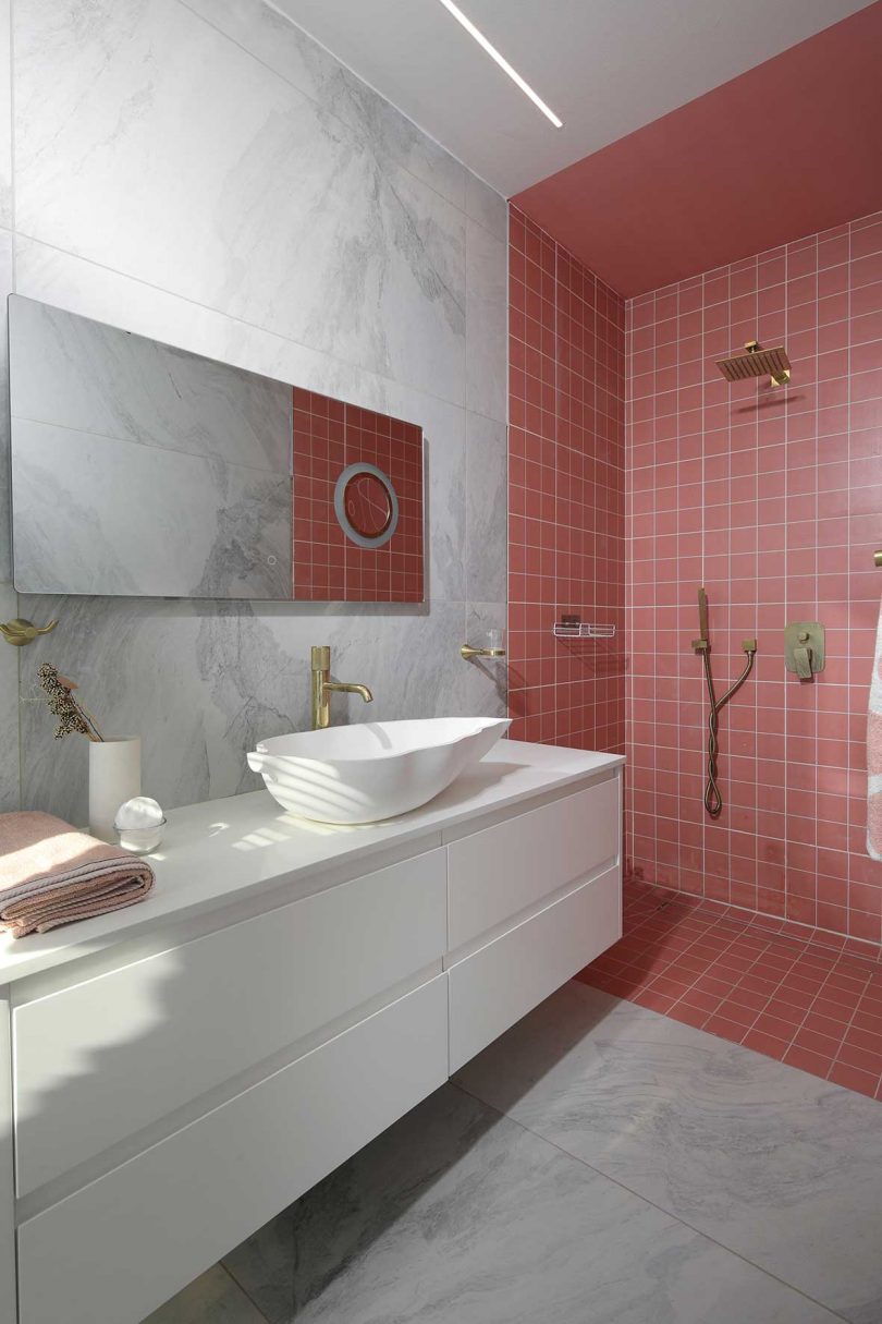 modern white bathroom with coral tile