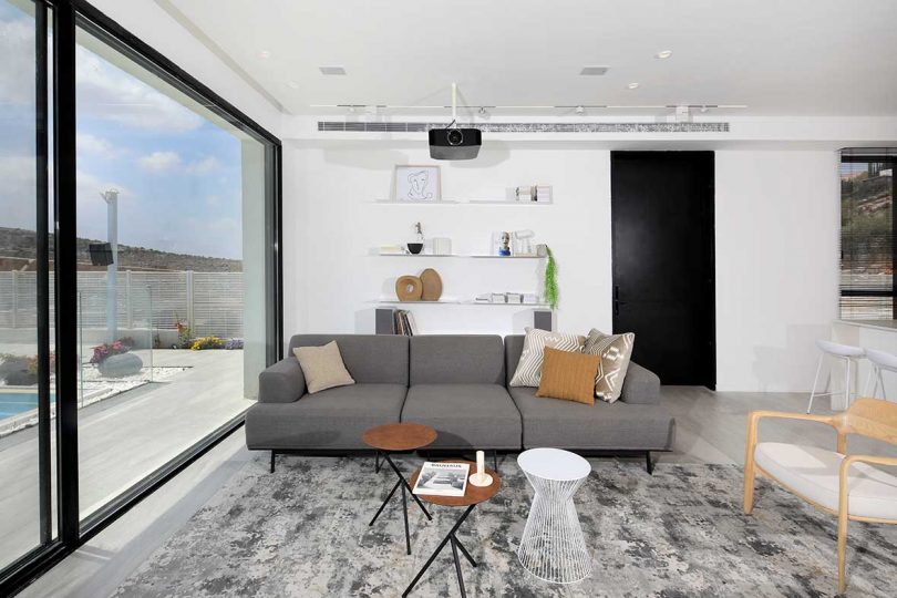 modern white living room with gray sofa