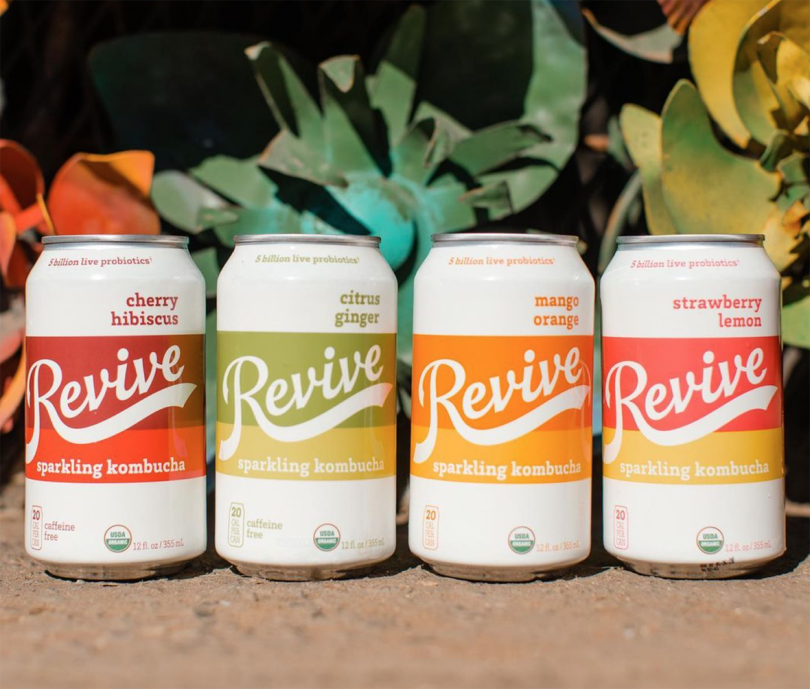 four side by side beverage cans reading Revive
