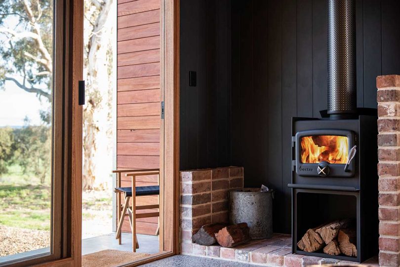 corner view of wood burning stove in cabin