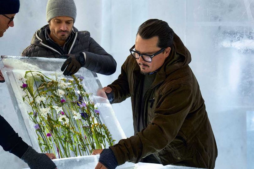 making ice blocks filled with flowers to create walls of an ice suite at the Icehotel