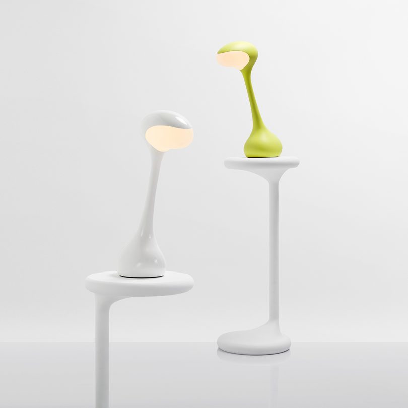 two task lamps on white pedestals in white space