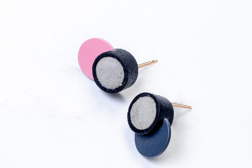 colorful concrete earrings on white background