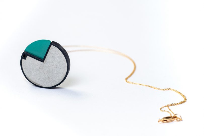 colorful round concrete necklace on white background