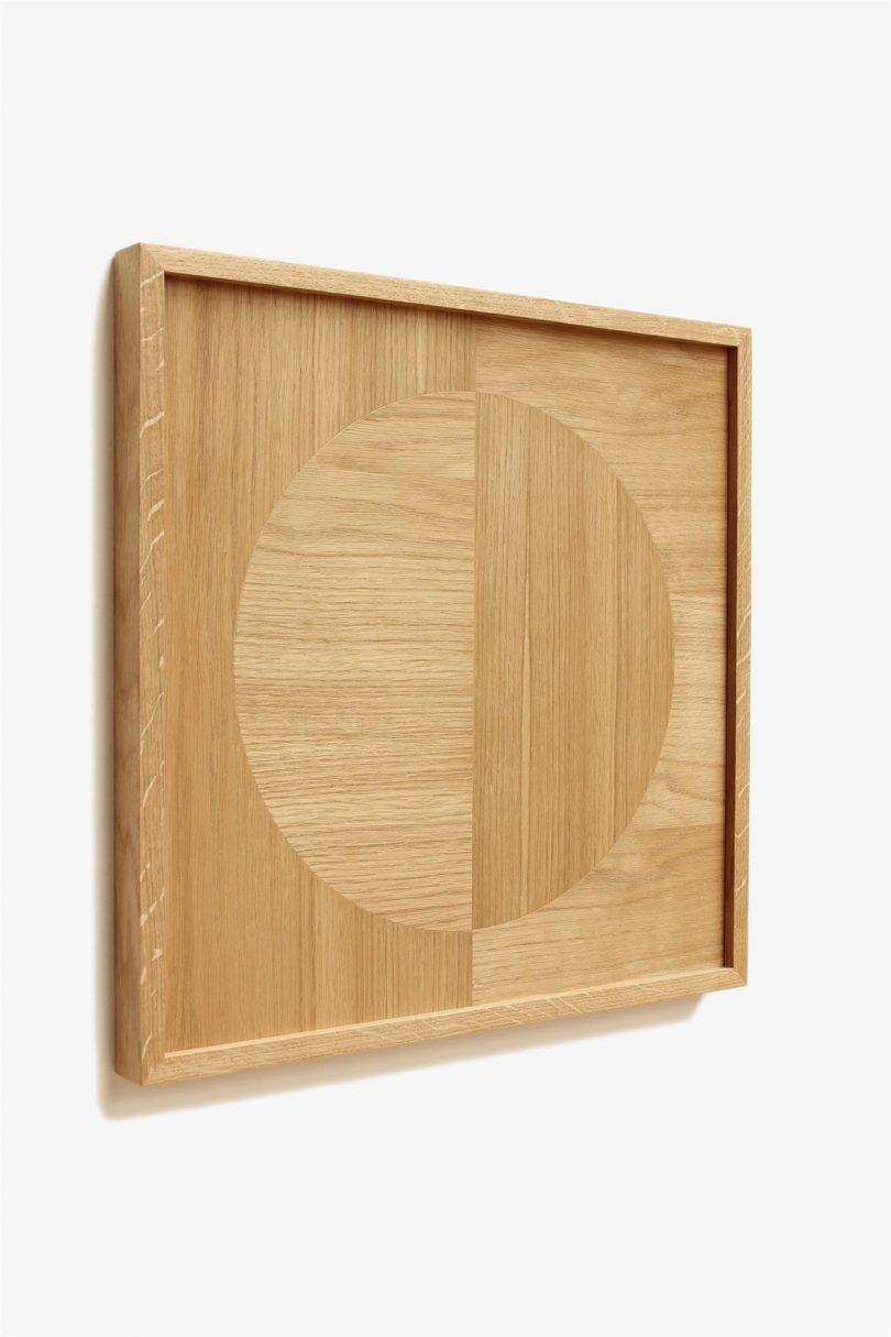 wood marquetry art hanging on a wall