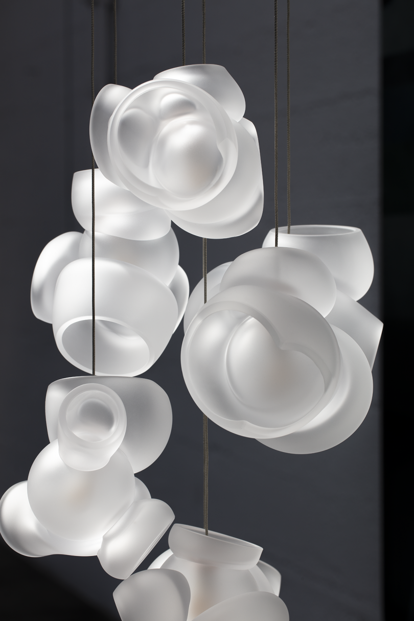 glass light fixture against grey background