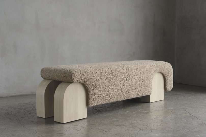 light wood bench with sherpa upholstery