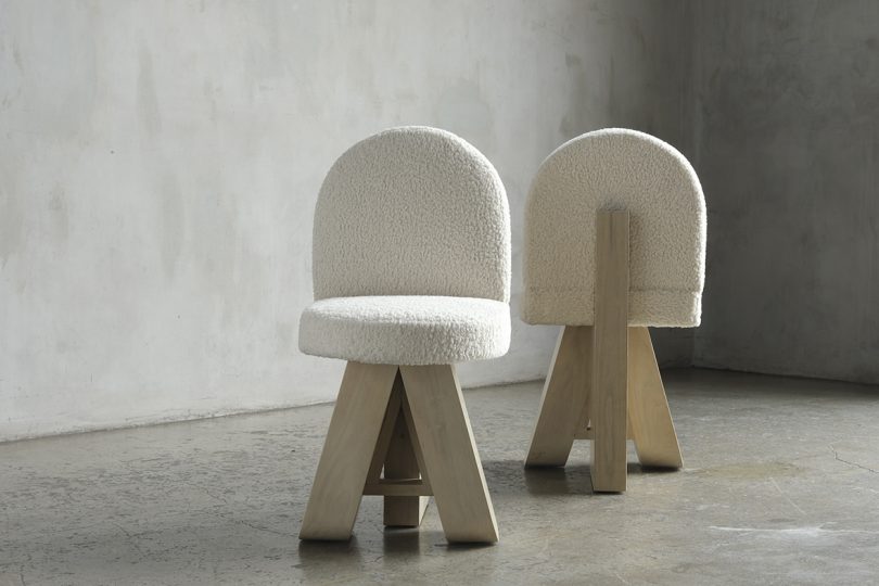 two light wood chairs with sherpa upholstery