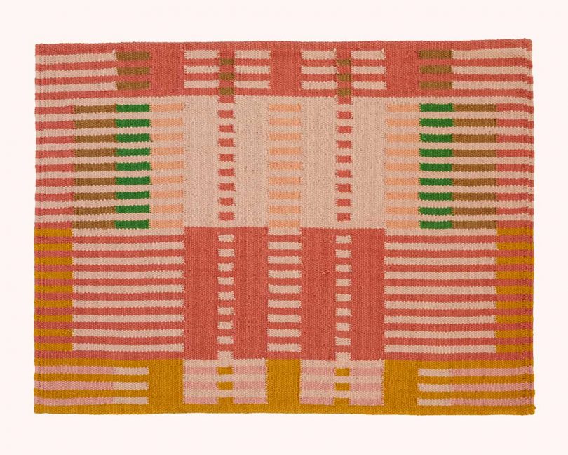 rug with vibrant linear pattern and color blocking