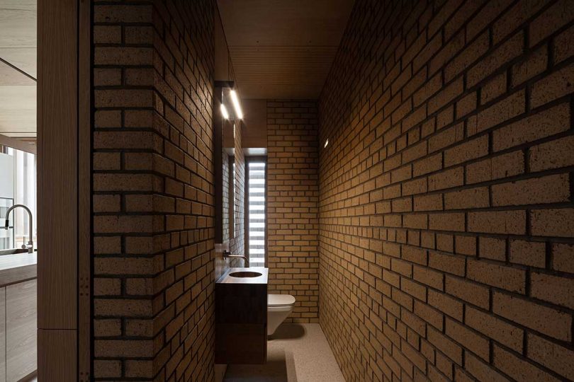 modern bathroom with brick walls