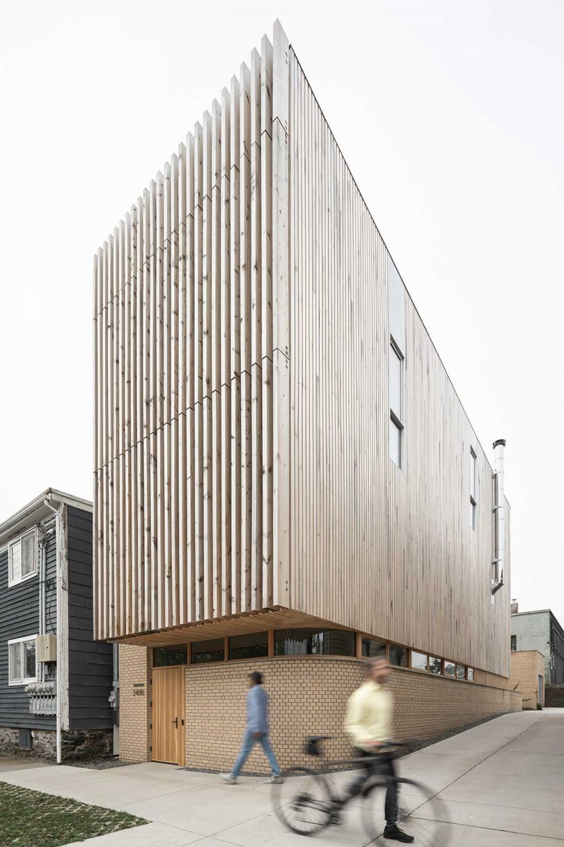 corner shot of tall narrow modern house with vertical wood slats