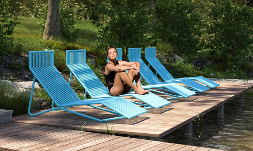 light blue sun loungers outdoors with woman wearing black bathing suit