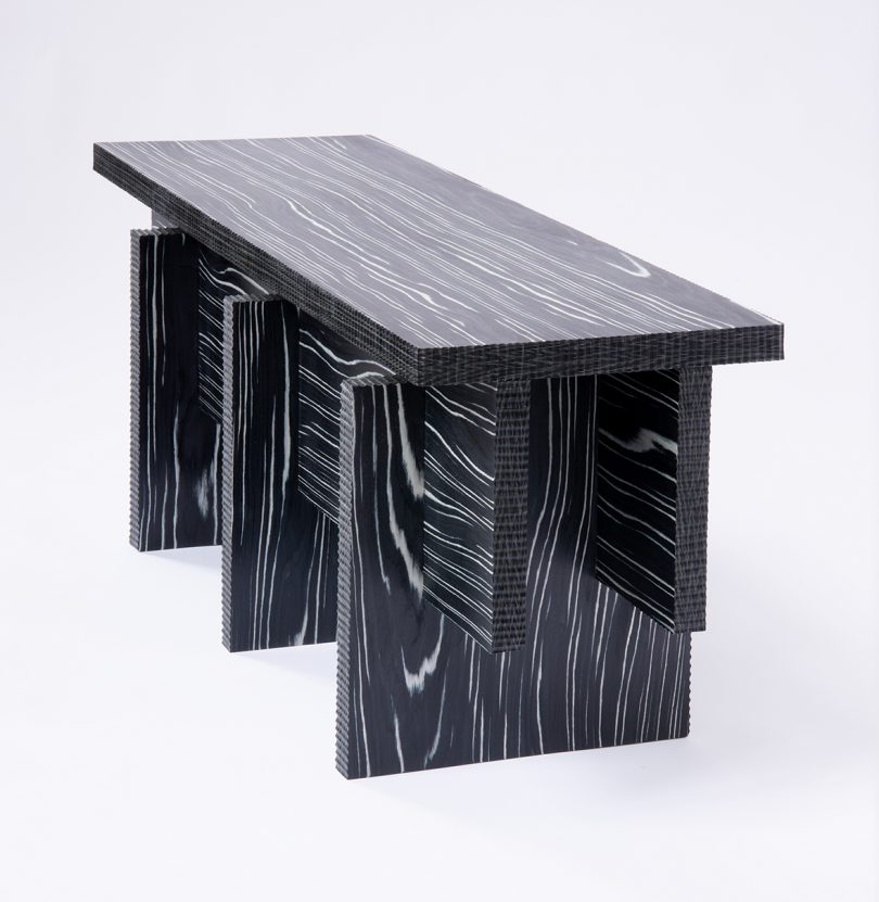 dark bench made of Alpi wood on white background