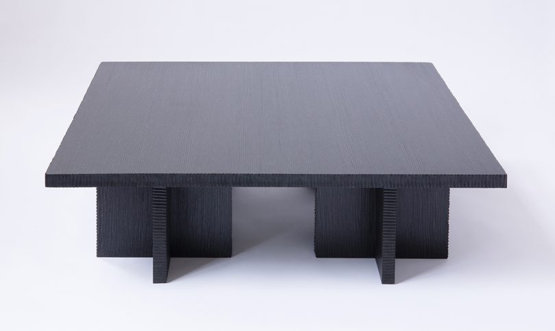 dark coffee table made of Alpi wood on white background