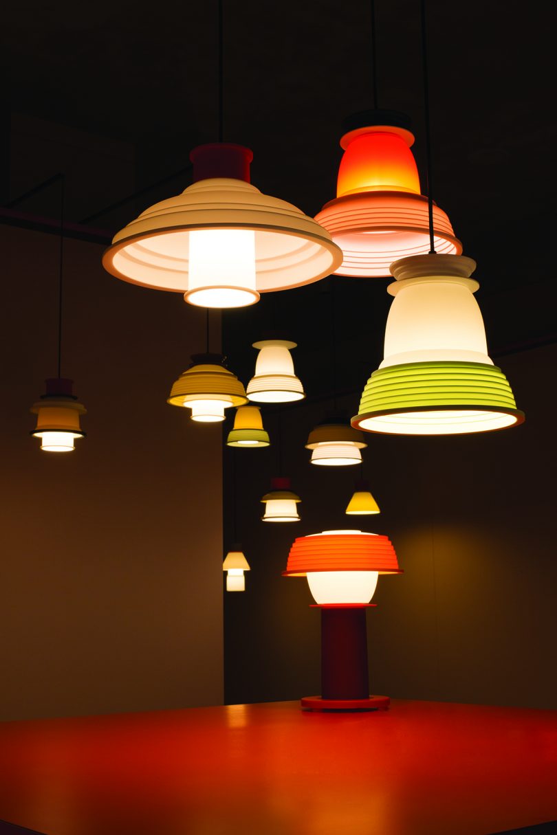 several colorful pendant lights suspended from the ceiling