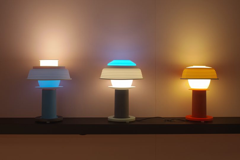 three lit table lamps