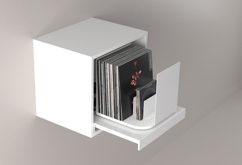 White cube record storage shown with drawer and record holder open with 12" and 7" records on display.