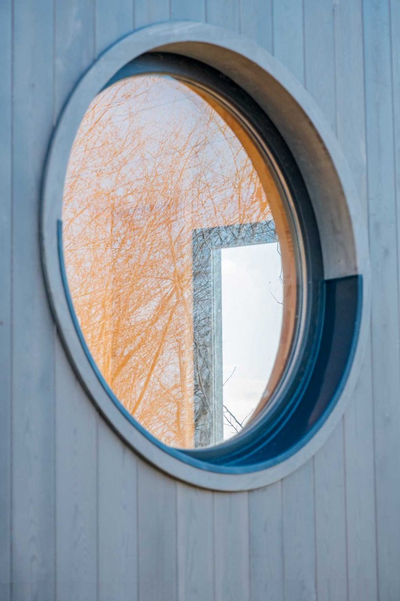 closeup of round window in tiny cabin