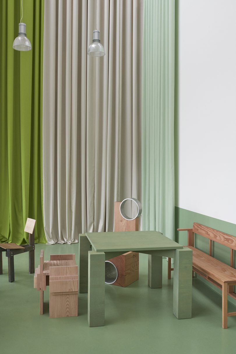 olive green and white cafe space with wood furniture