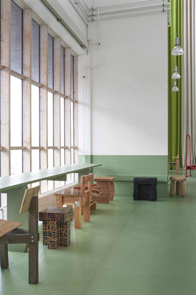 olive green and white cafe space with wood furniture