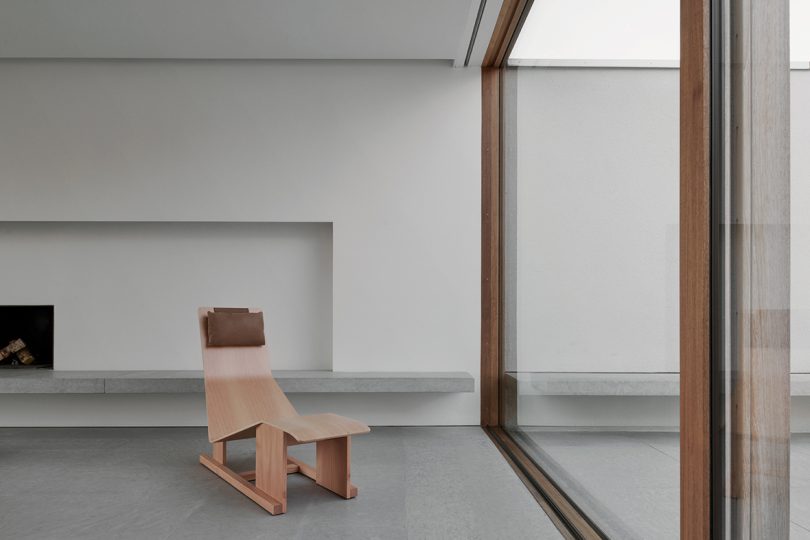wood lounge chair in minimalist space