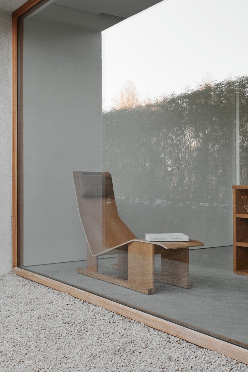 wood lounge chair in minimalist space