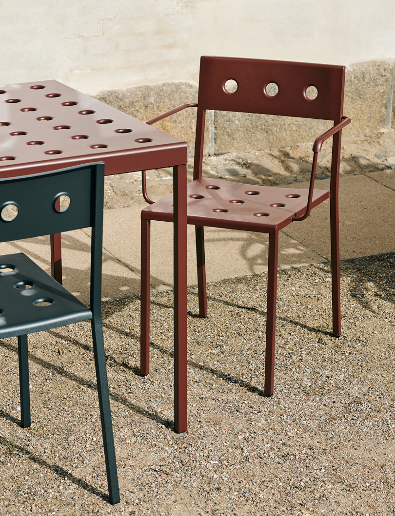 rust colored outdoor armchair and table