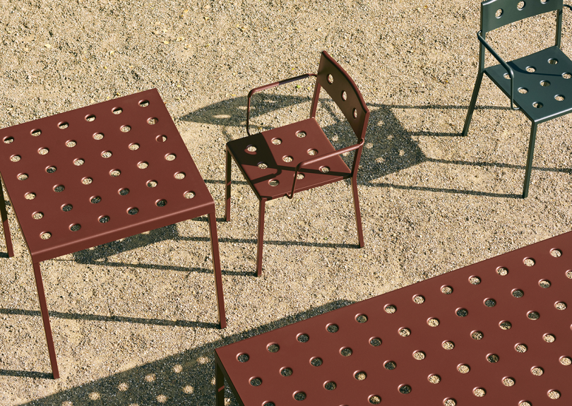 rust colored outdoor armchair and tables