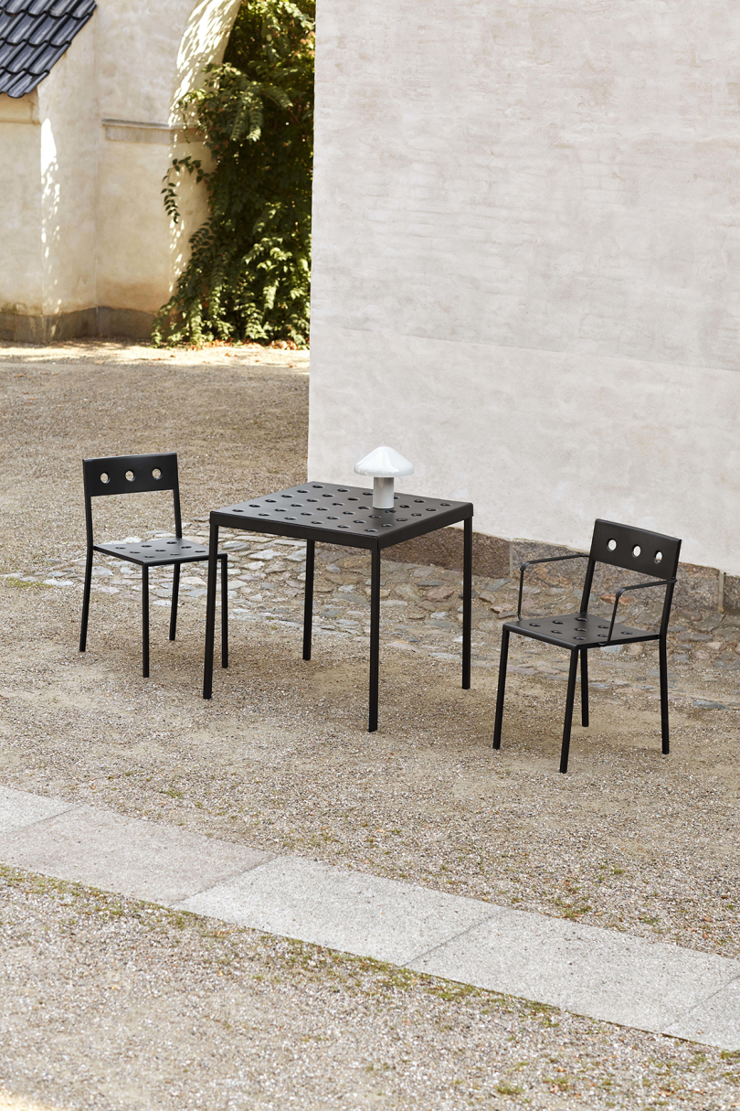 black outdoor armchairs and table