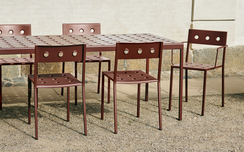 rust colored outdoor chairs and table