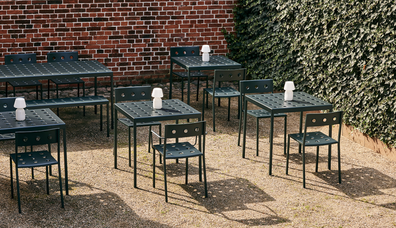 dark green outdoor chairs and tables