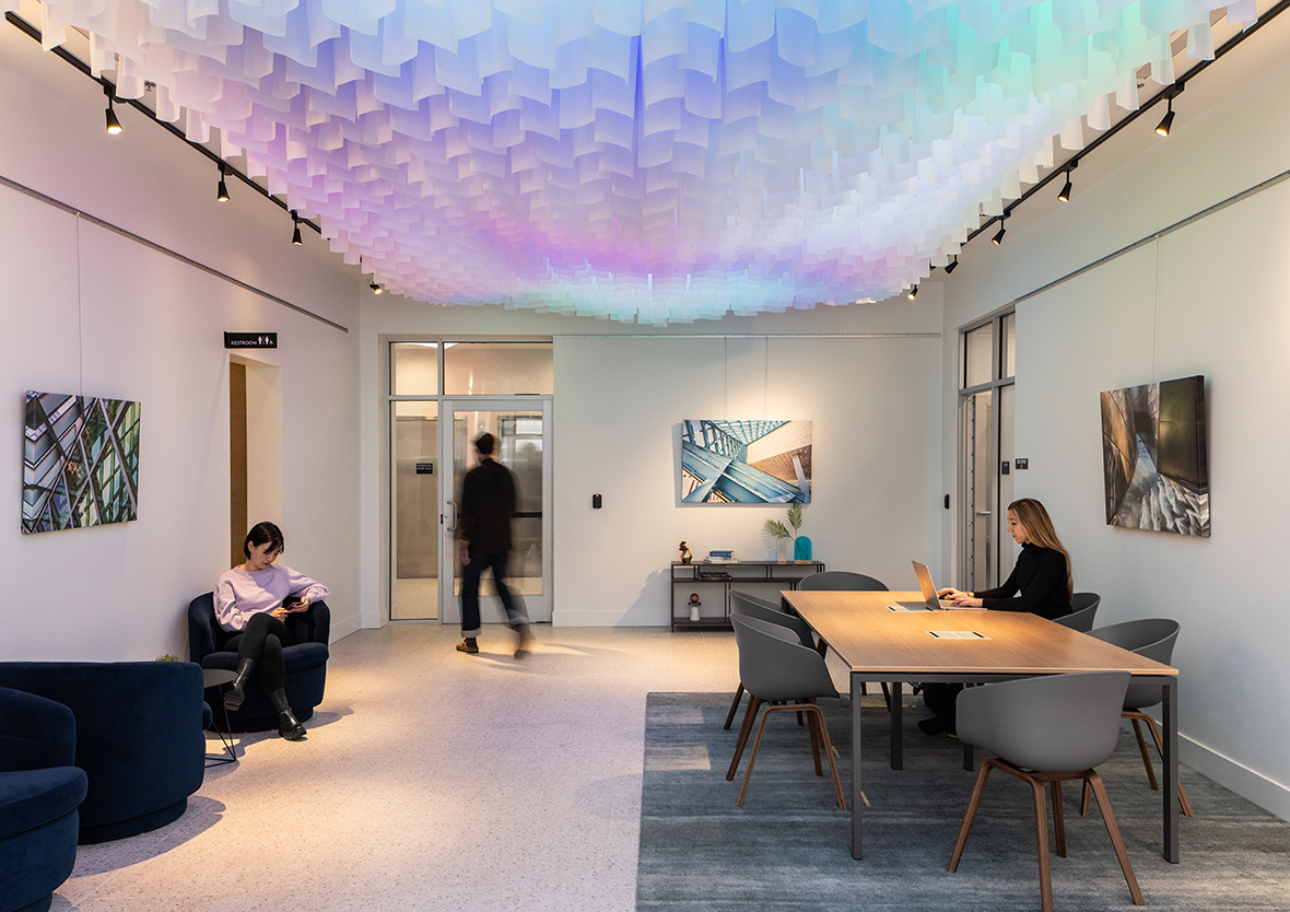 1000 LED-Illuminated Translucent Flags Transform This Lobby Into a Digital Sky