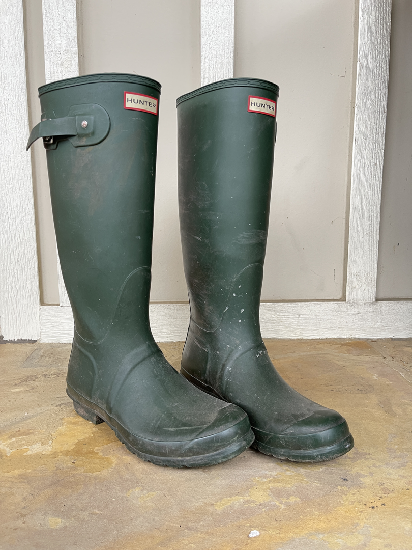 pair of dark green rain and gardening boots