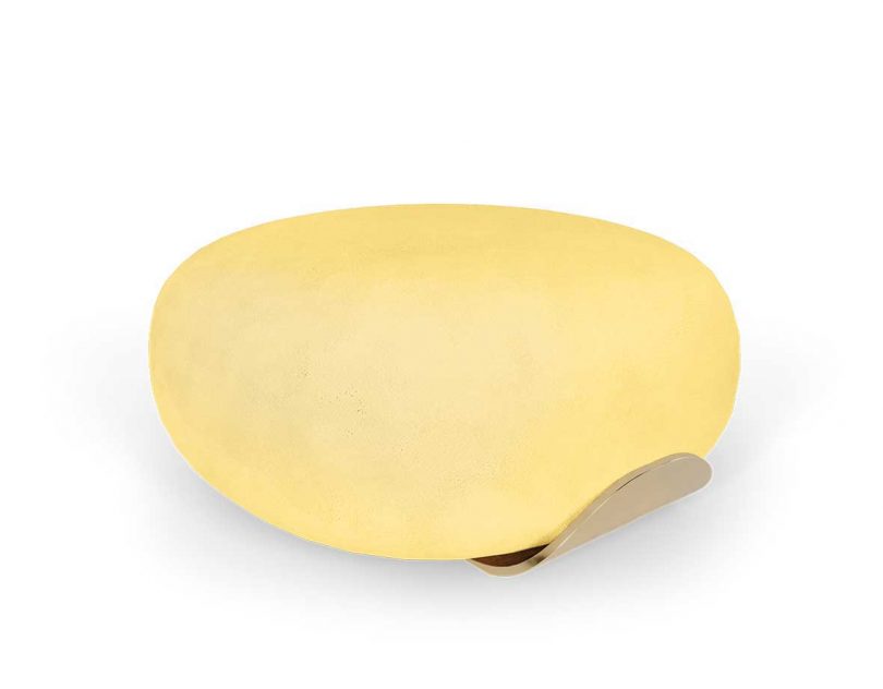 round light yellow ottoman on white background