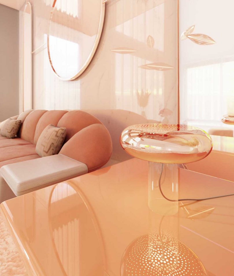 pink sofa, table lamp, and wall mirror
