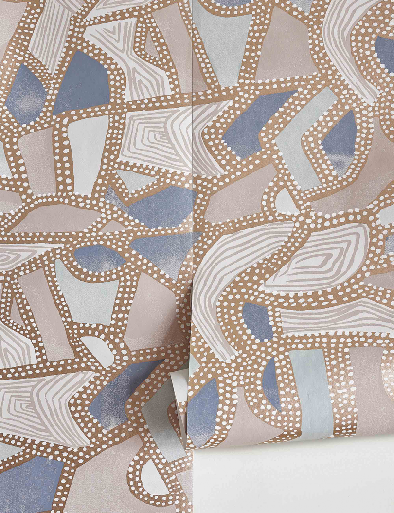 detail of blue and brown patterned wallpaper roll