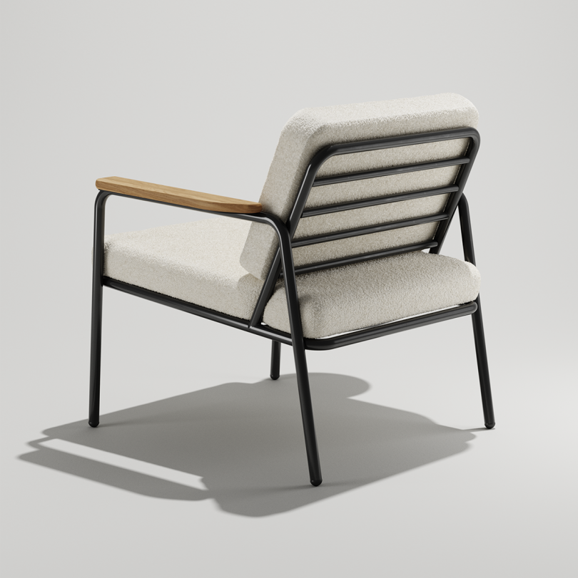 rear of black indoor/outdoor armchair with white cushions on white background