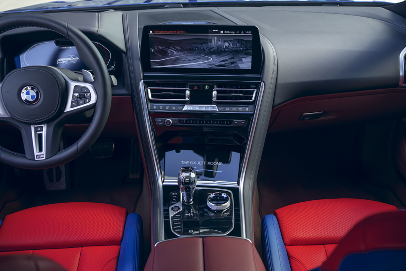 interior dashboard with black, red, and blue features