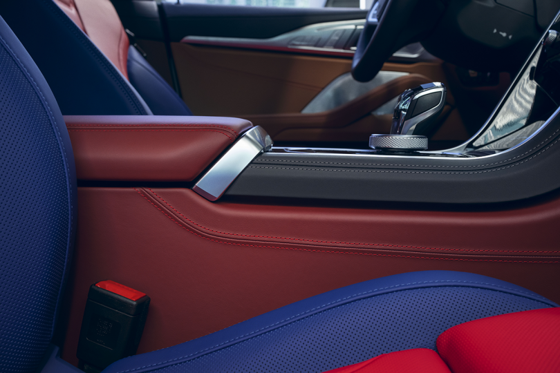 interior of car with black, maroon, blue, and red features