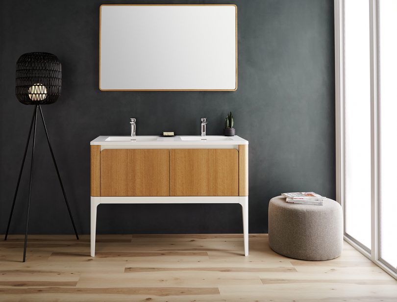 styled white and wood bathroom double vanity with legs