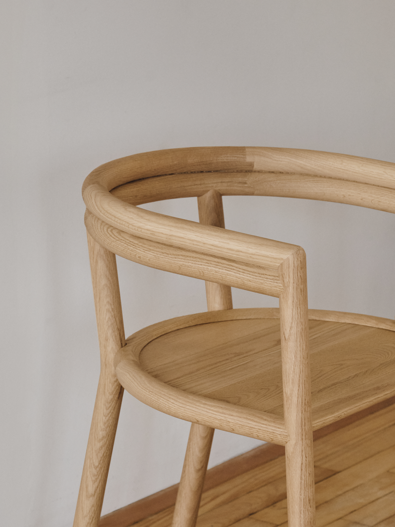 curved wood armchair