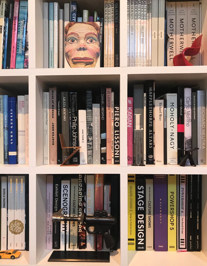 bookshelves filled with books and small objects