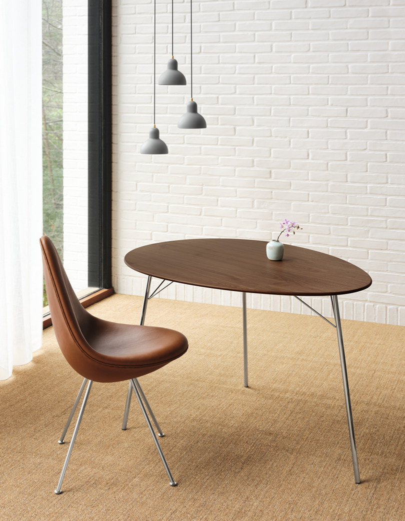 egg shaped table and chair with three pendant lights