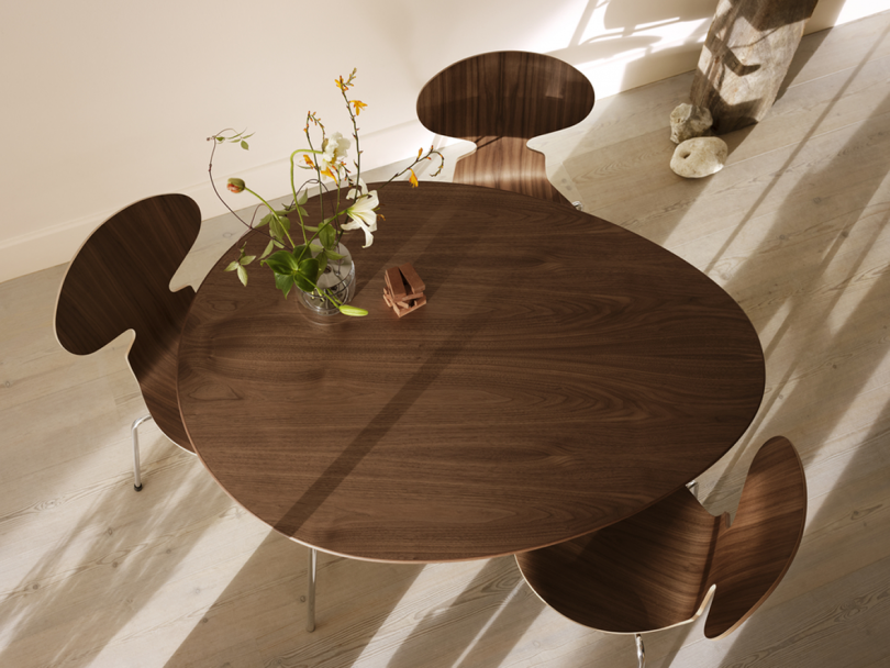 overhead image of egg shaped table and three chairs