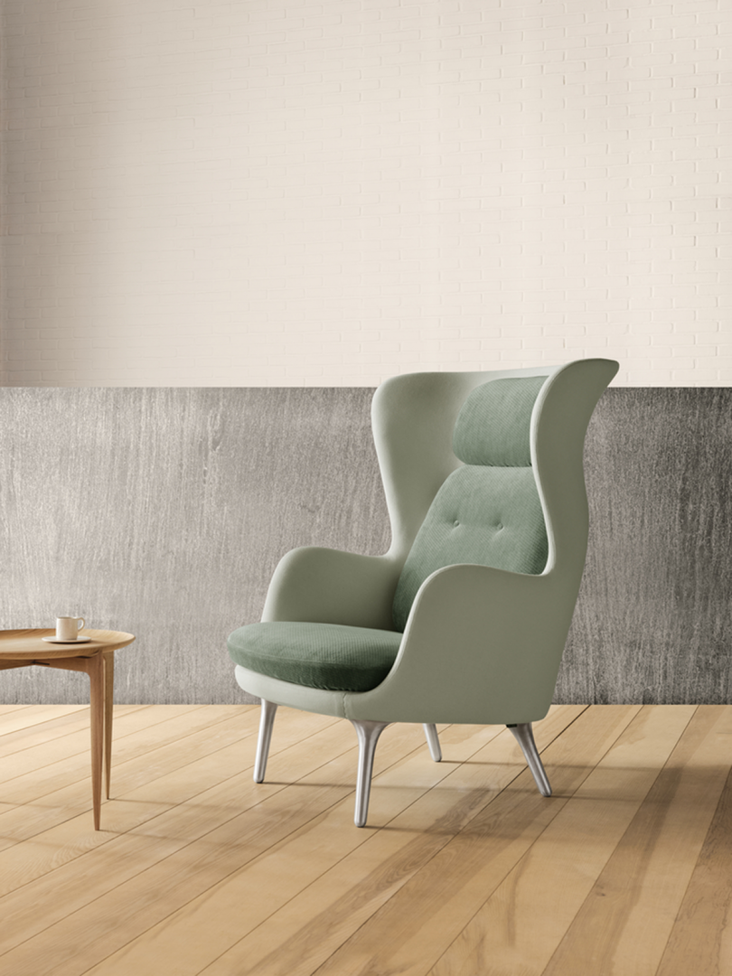 light blue/green upholstered armchair in living space