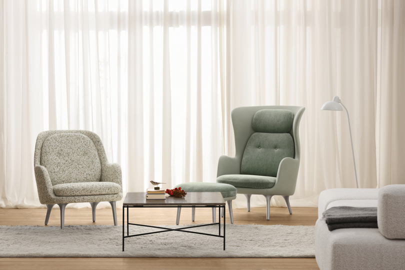 light grey and light blue upholstered armchairs with coffee table in living space