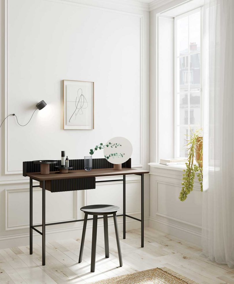 styled dark wood desk in living space
